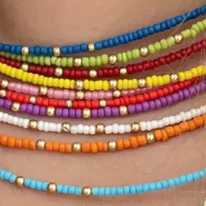 گردنبند و دستبند و گوشواره و پابند منجوقی